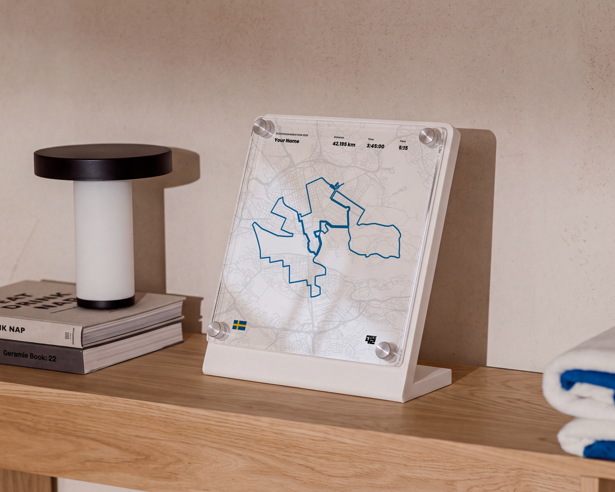 Custom Stockholm Marathon achievement display featuring the marathon route and personalized finish details in a modern interior